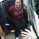 Charlena Michelle Cooks in the back of the police cruiser
YouTube
